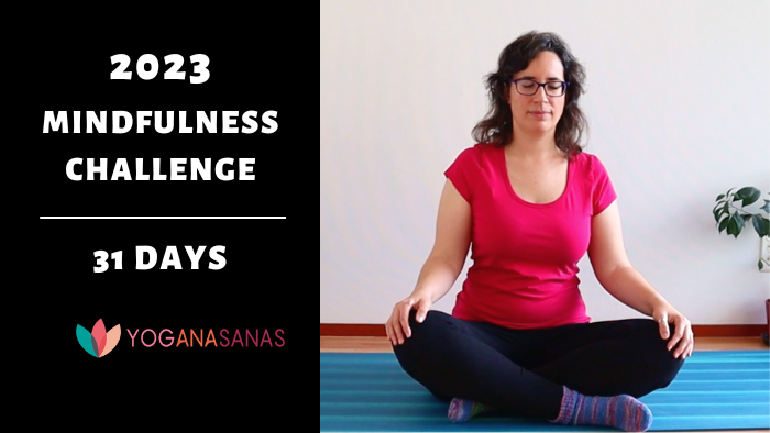 on the left there is black background with white letters: 2023 mindfulness challenge 31 days" with the logo of Yoganasanas. On the right you see a picture of Ana crossed legs seated with her eyes closed. 
